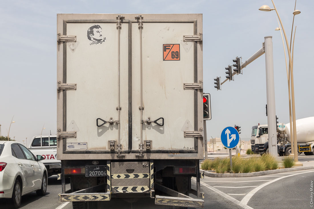 A Qatar black camion plate 207004, Tamim Al Majd graphic logo on stickers on a truck. Портрет шейха Тамим бин Хамад Аль Тани на стикере на фургоне грузовика. Катарский чёрный автомобильный номер 207004